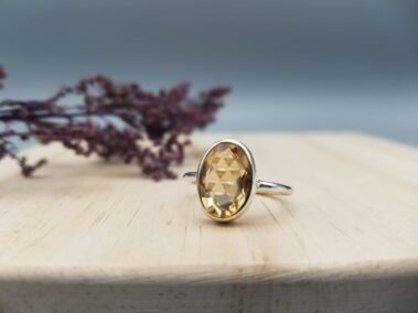 orange citrine faceted ring in a simple sterling setting