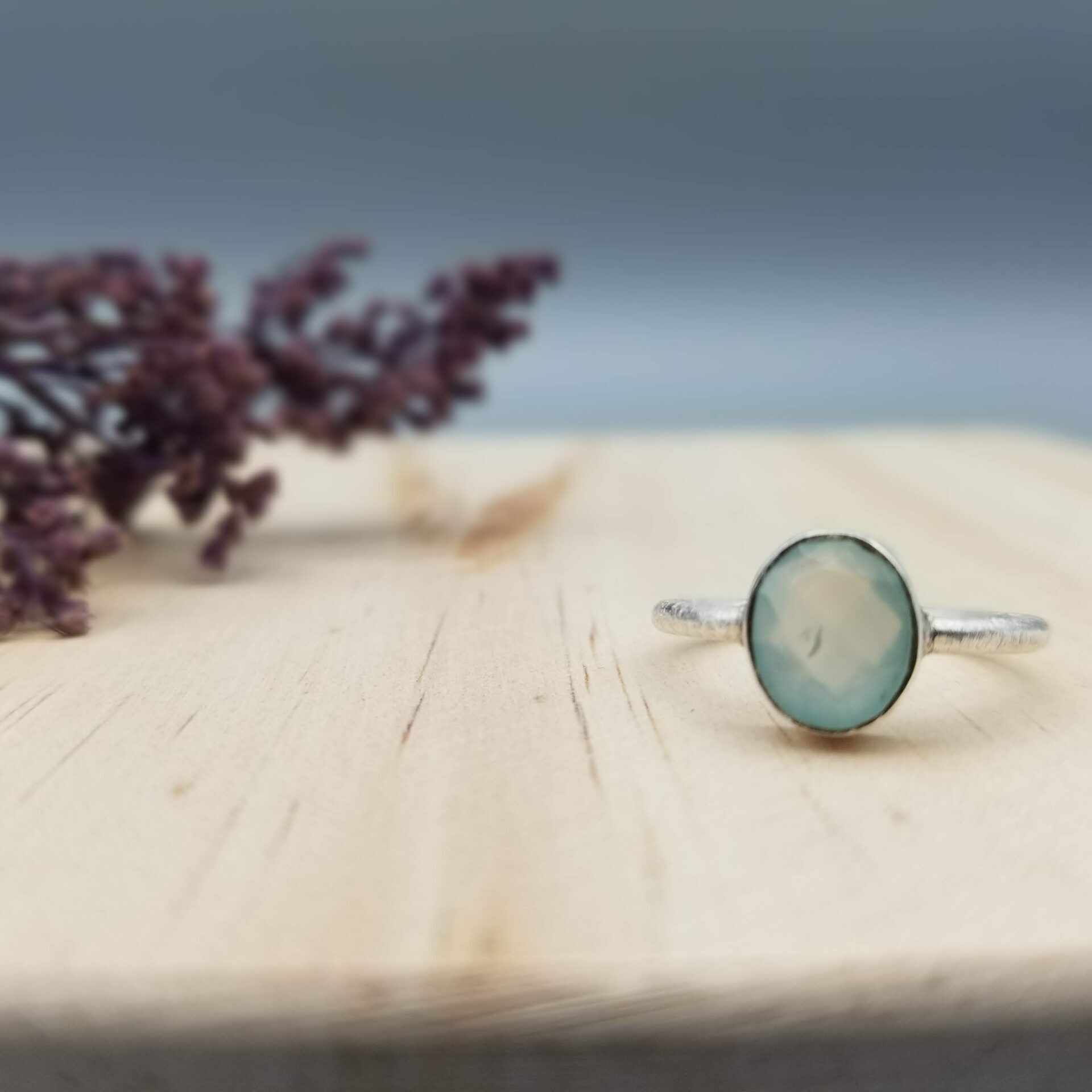 simple, modern aqua blue chalcedony ring in sterling silver setting
